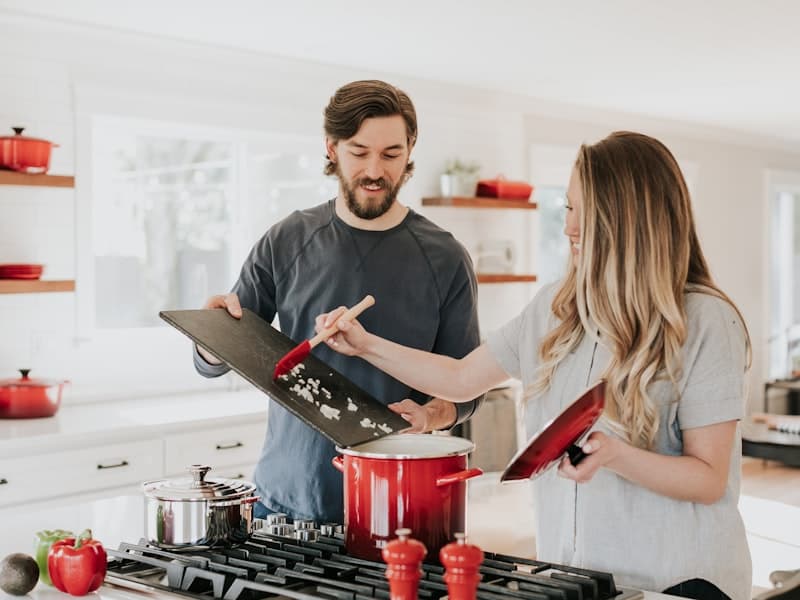 Person taking a pill casually, morning routine, kitchen
